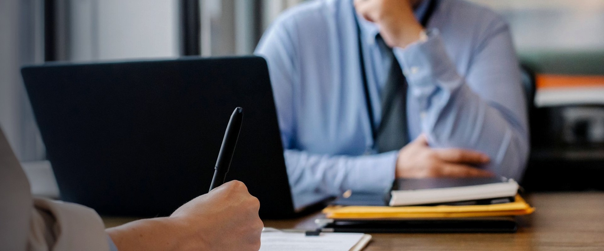 Lawyer and client signing an agreement