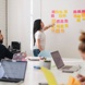 Colleagues talking in a bright office